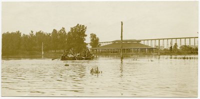 Soldiers Paddling a Rowboat Across a Flooded Area by Carl Michel